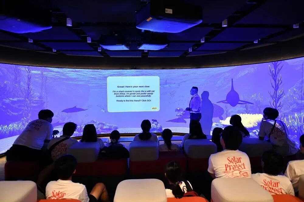 Students explore the Meta Space metaverse experience with immersive screens at YWIES Zhejiang Tongxiang