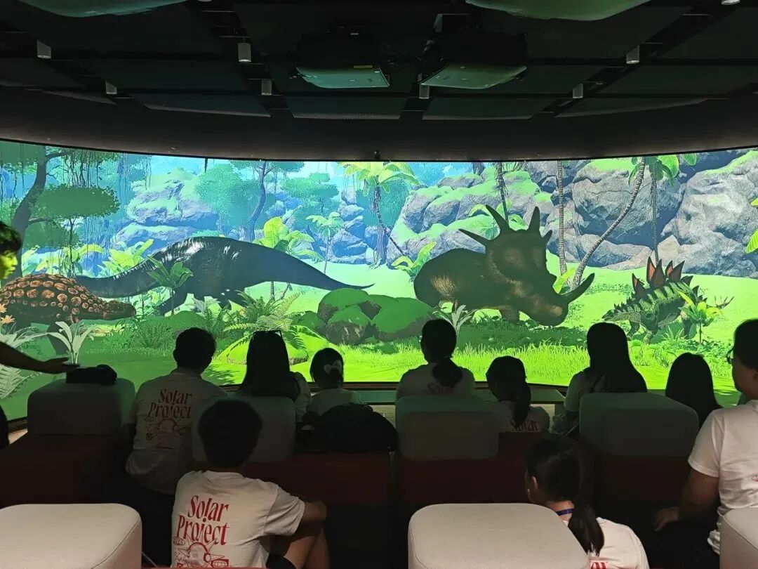 Hong Kong students interact with touch-screen devices in META Space at YWIES Zhejiang Tongxiang