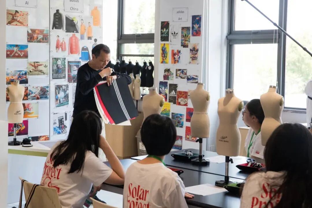 Fashion Design Workshop: students sketch and discuss design ideas at YWIES Zhejiang Tongxiang
