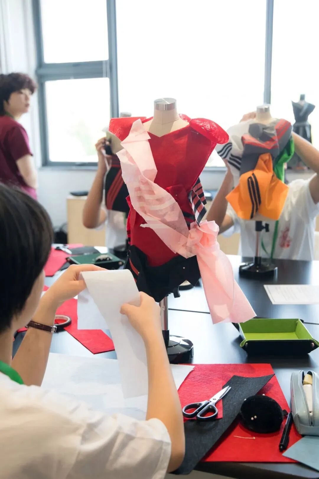 Student showcases a prototype outfit during Fashion Design Workshop at YWIES Zhejiang Tongxiang