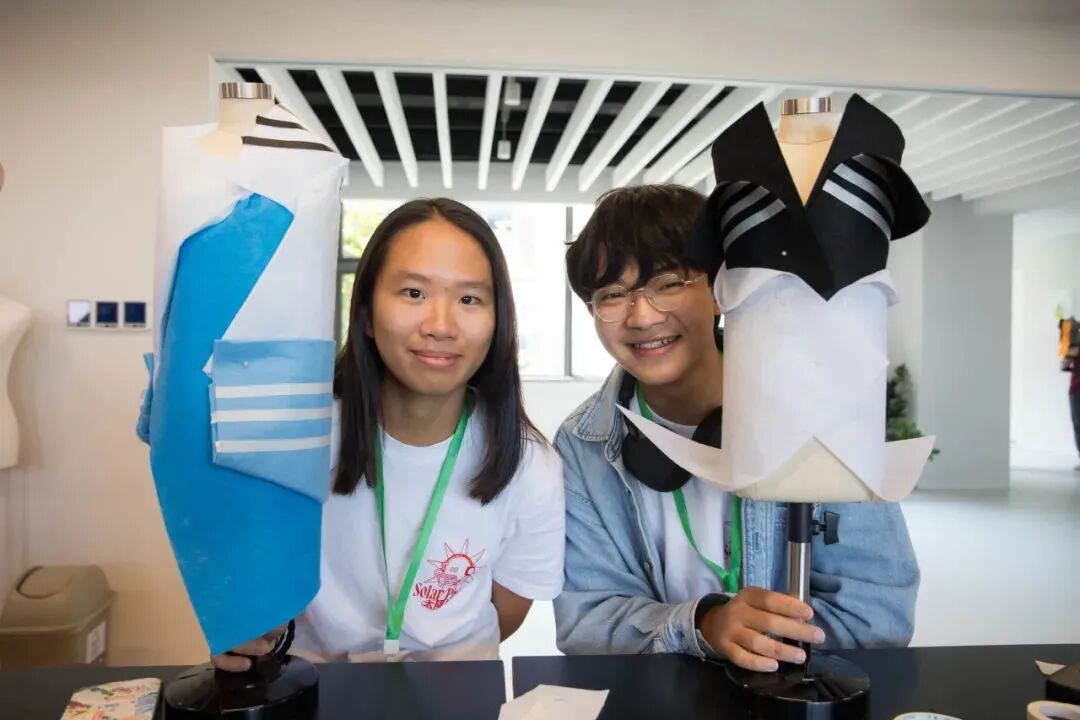 Collaborative garment-making and styling activity at YWIES Zhejiang Tongxiang